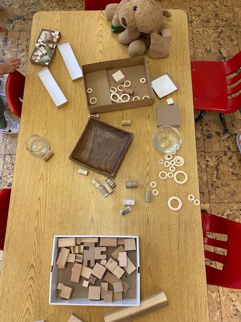 Different wooden shapes displayed on a child's table
